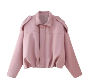 Detail of pink cropped bomber jacket with lapels and shoulder straps on white background