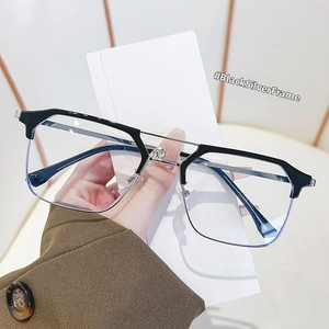 Detail of retro black and silver semi-rimless frames with anti-blue light clear lenses