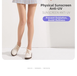 Detail of ultra-thin skin-tone stockings with anti-UV sun protection under a plaid skirt