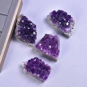 Set of four natural Uruguay amethyst crystal clusters with deep purple mineral textures