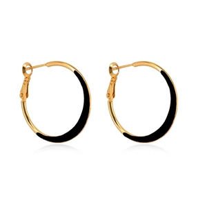 Macro view of gold hoop earrings with black enamel and S925 silver needle hallmark