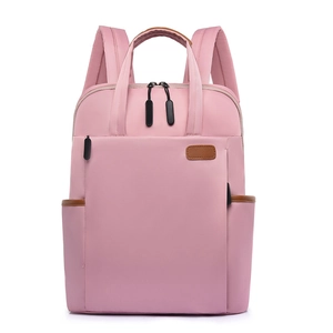 Pink Oxford fabric backpack for women with brown leather accents for travel or school