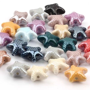 Colorful starfish glazed ceramic beads for DIY jewelry making displayed on white background