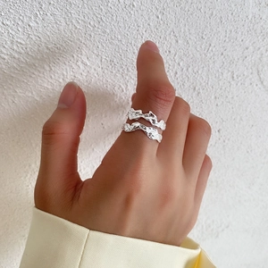 Minimalist irregular crumpled texture S925 sterling silver ring worn on female hand