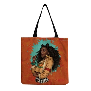 Detailed view of reusable tote bag with artistic African woman print and King graphic