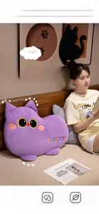Close-up of purple plush cat pillow featuring LUCKY embroidery and soft fuzzy texture