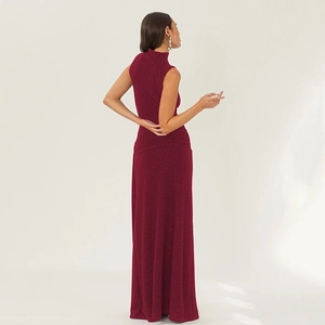 Detail of burgundy glittering fabric on a slim fit sleeveless evening maxi dress