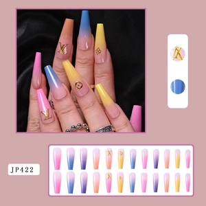 Detailed view of long coffin press-on nails with colorful gradients and gold logo patterns
