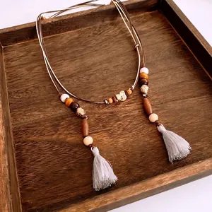 Bohemian ethnic waist chain belt with wooden beads, elephant pendant, and grey tassels