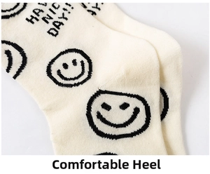 Macro detail of comfortable heel seam on cream cotton smile socks with slogan text