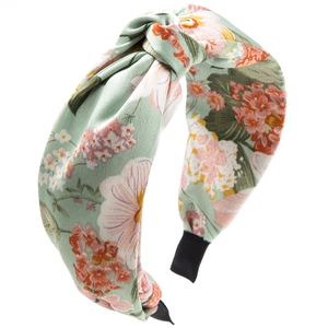 Detail of floral bohemian knot headband in mint green with soft fabric texture