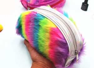Macro view of rainbow faux fur pencil case with silver holographic leather trim and zipper
