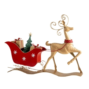 Golden Christmas reindeer and red sleigh decor with mini tree and gift boxes on white background