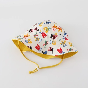 Detail of kids reversible sun hat with colorful graffiti prints and adjustable wind cord