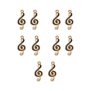 Close-up of ten gold music note charms with black enamel finish and small rhinestones