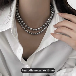 Detail of grey pearl double layer necklace with 6mm and 10mm diameter beads