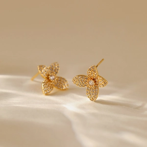 Fashionable 18K gold-plated leaf stud earrings with sparkling pavé crystals for women