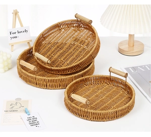 Detail of round hand-woven fruit trays with wooden handles in three nested sizes