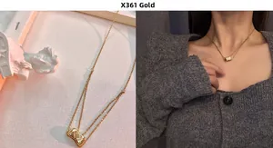 Close-up of double-layered gold titanium necklace with quilted barrel pendant for women