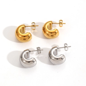 Minimalist C-shaped thick hoop earrings in gold and silver finish with polished surface