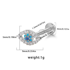 Macro view of blue devil eye labret stud with detailed size specifications in millimeters