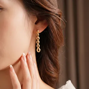 Elegant gold-tone wheat ear tassel earrings featuring five nested hollow teardrop pendants