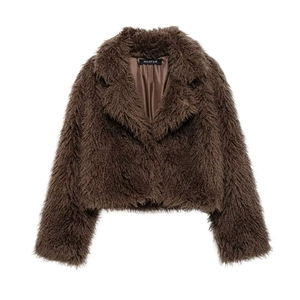 Detail of deep brown faux fur jacket showing lush texture and wide lapel collar