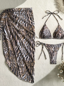 Three-piece tiger print bikini set with a sheer matching mesh beach cover-up skirt