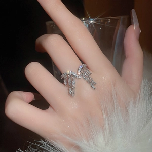 Macro detail of zircon fringe ring with silver tassels and marquise cut stones