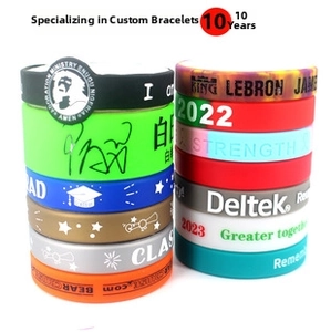 Detailed view of colorful customized silicone wristbands with debossed motivational text