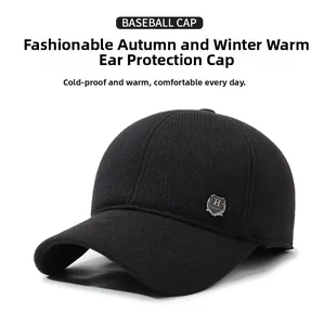Close-up of black wool baseball cap with protective earflaps and H Sport metal logo