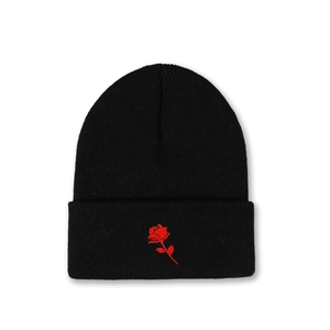 Black knit beanie with red rose embroidery on the folded cuff, minimalist warm winter hat
