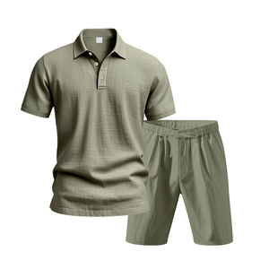 Detail of sage green men's linen polo and shorts set showing fabric texture and M size label