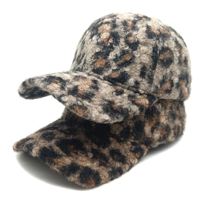 Plush leopard print baseball caps for winter, showing thick faux wool texture on white background