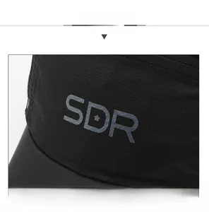 Close-up of black breathable mesh fabric and SDR logo on the side of baseball cap