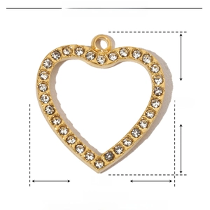Macro view of golden hollow heart pendant with white rhinestones and 16mm dimension scale