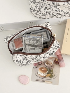 Pochette organizer in velluto a coste bianco con motivi floreali e cerniera marrone