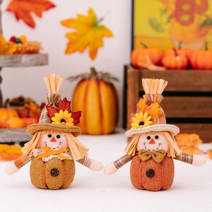 Pair of autumn pumpkin scarecrow gnomes with sunflowers and maple leaves decor