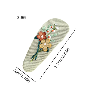 Floral embroidered fabric BB hair clip in light green with dimensions and weight info