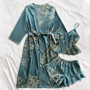Three-piece satin floral loungewear set with teal robe, camisole, and ruffled shorts