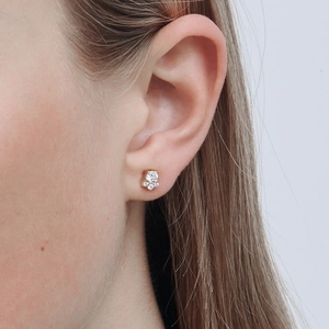 Macro detail of high-quality 925 sterling silver five-petal flower zircon stud earring