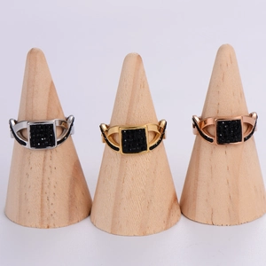 Three-piece ring set in gold, silver and rose gold with black square pave crystals