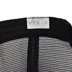 Detail of internal care label showing 50% cotton and 50% polyester blend on mesh cap