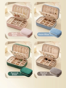 Four colors of velvet jewelry boxes including pink blue green and grey for portable storage