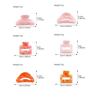 Acrylic hair claw clips set with glitter marble texture in pink and orange tones