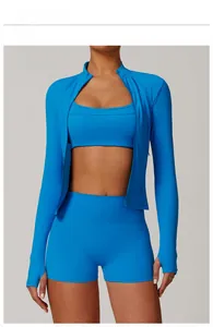 Detail view of electric blue three-piece yoga set with zip-up jacket and shorts