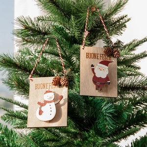 Wooden Christmas hanging ornaments featuring Santa and Snowman with Buone Feste carving