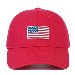Close-up of American flag embroidery on red cotton twill baseball cap with fine stitching