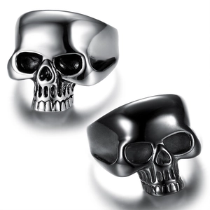 Detail of gothic skull rings in polished silver and matte black stainless steel finish