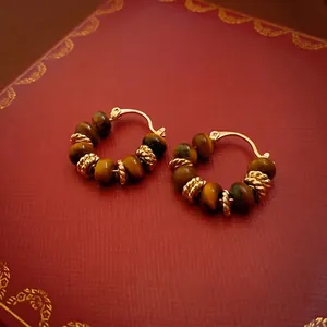 Vintage gold plated tiger eye beaded hoop earrings with textured metal accents